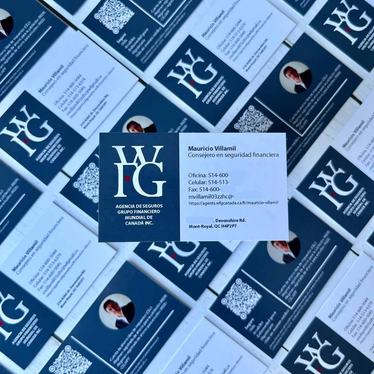 Pattern of blue and white business cards with contact information.