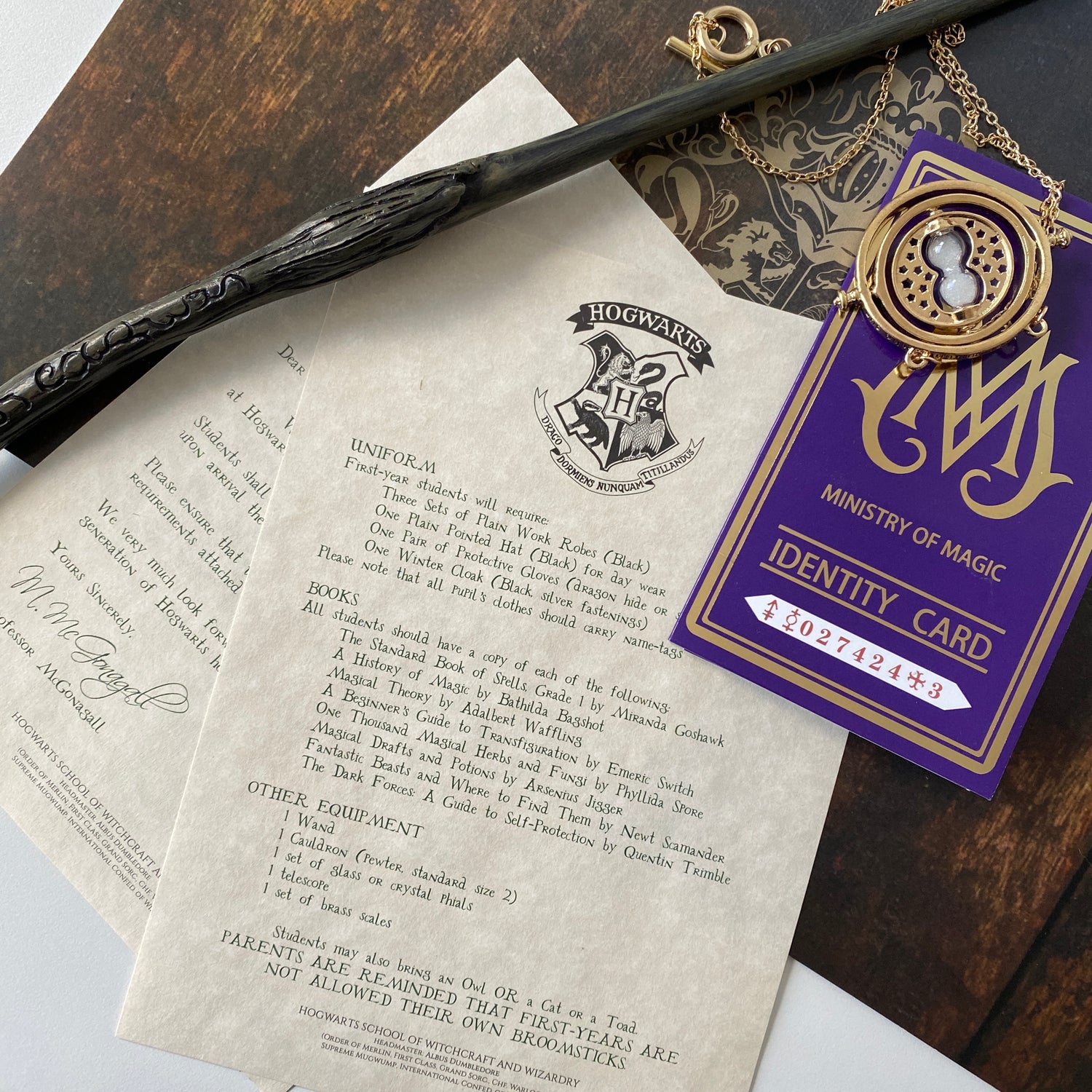 Hogwarts acceptance letter, want and identity card