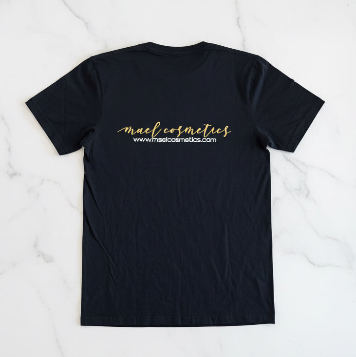 Black t-shirt with 'mael cosmetics' text on a marble surface