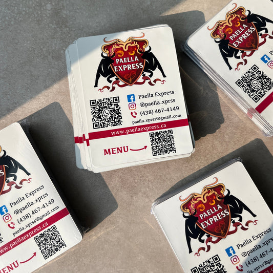 Multiple magnets with a logo and QR code on a textured surface