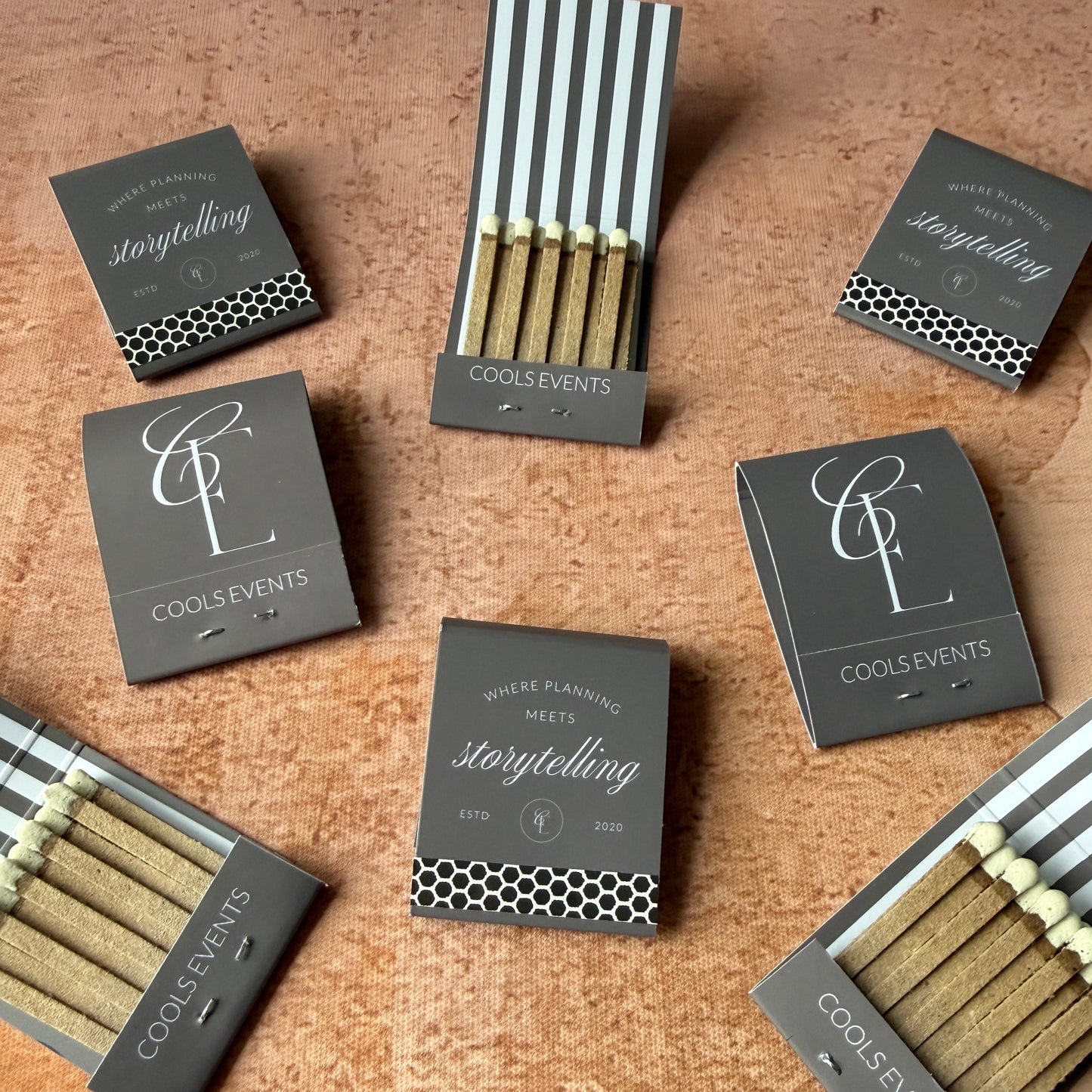 Matches with branded packaging on a textured surface